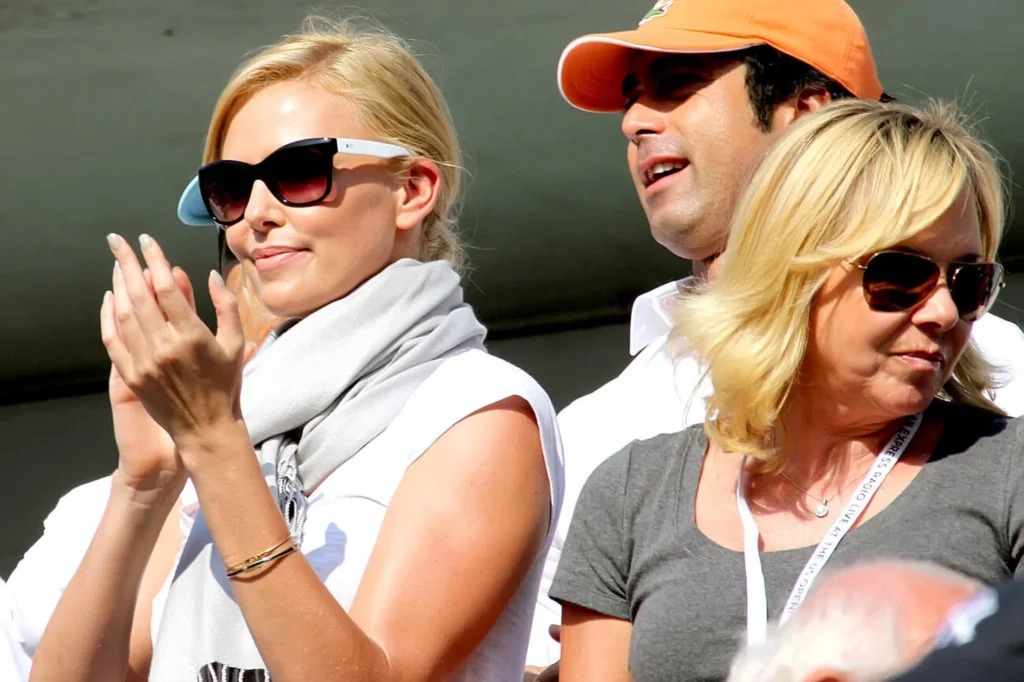 Charlize Theron and her mother Gerda Theron enjoying the 2010 US Open men's finals match, seated in the stands