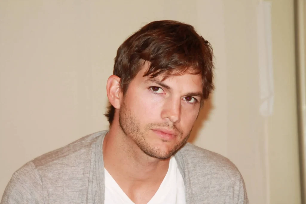 Portrait of Ashton Kutcher looking confident and relaxed.